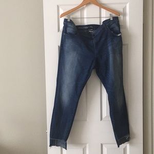Skinny jeans with step up hem